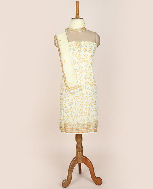 Yellow chudidhar material set, floral motifs printed top, plain bottom & sequins embroidered dupatta