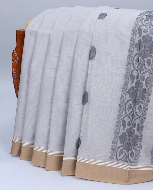 Grey kanchi cotton saree with buttas, contrast plain border & pallu of floral designs