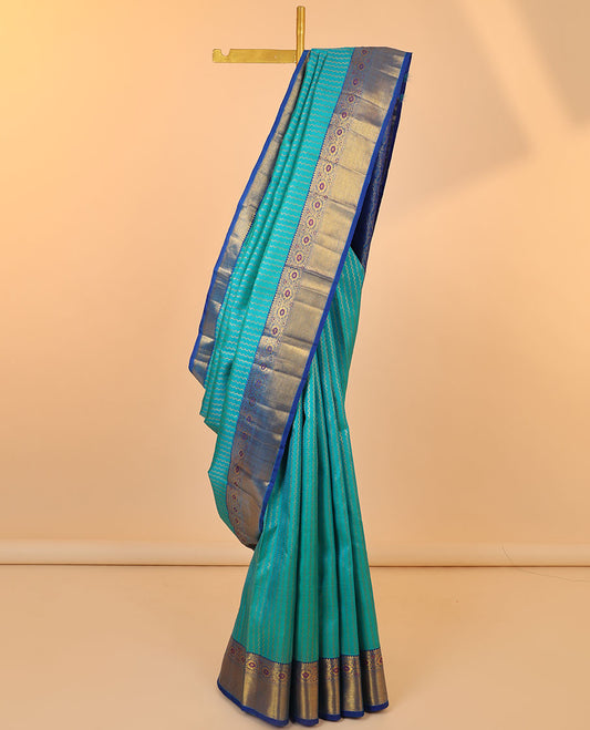 Blue neli striped silksaree,contrast floral jaal pallu & zari border of rekku,muthu,zari stripes & meenakari kodi visiry