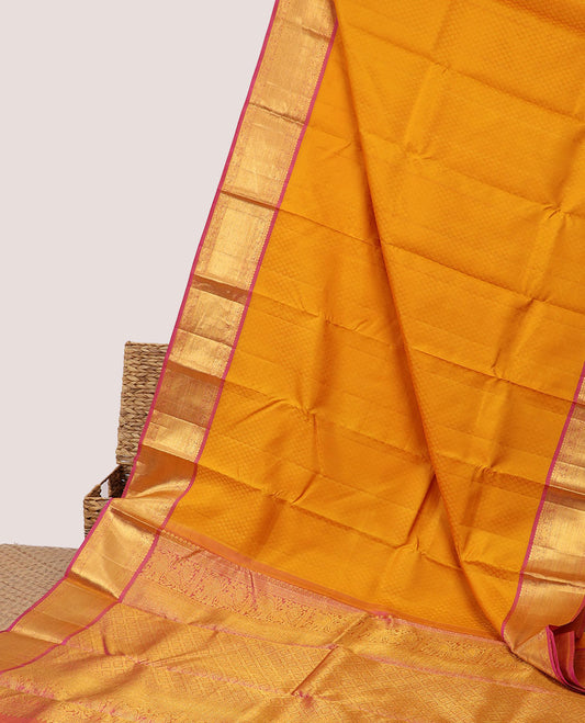Orange embossed silksaree, contrast jaal pallu & border of manga mokku,mayil,yaanai,banaras & vanki designs