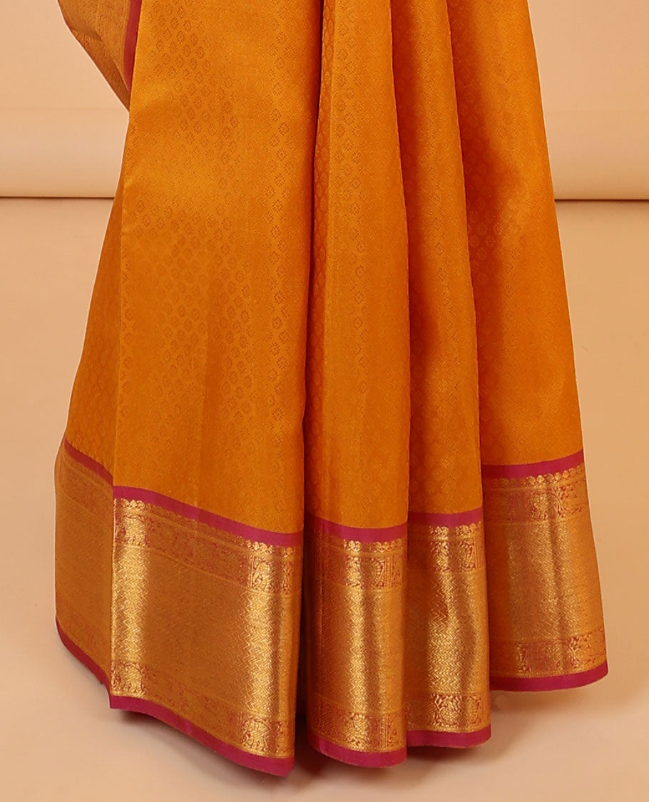 Orange embossed silksaree, contrast jaal pallu & border of manga mokku,mayil,yaanai,banaras & vanki designs