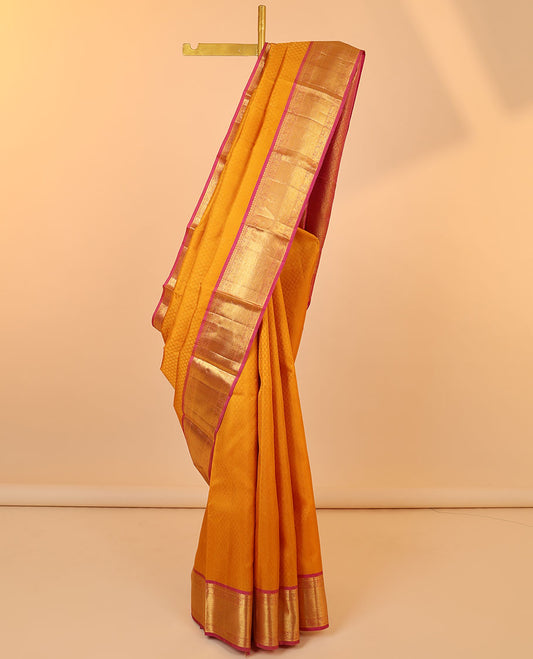 Orange embossed silksaree, contrast jaal pallu & border of manga mokku,mayil,yaanai,banaras & vanki designs