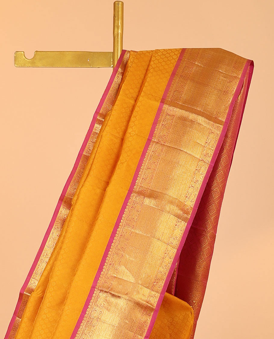 Orange embossed silksaree, contrast jaal pallu & border of manga mokku,mayil,yaanai,banaras & vanki designs