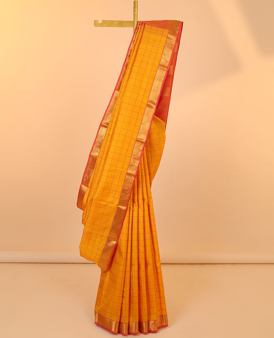 Orange checked silk saree, contrast zari border of muthu & vanki designs & pallu of zari designs