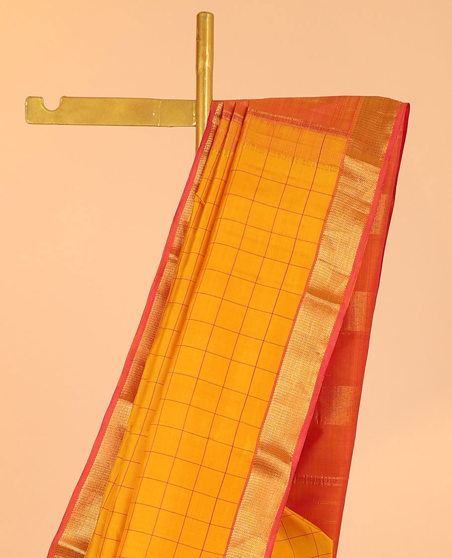 Orange checked silk saree, contrast zari border of muthu & vanki designs & pallu of zari designs