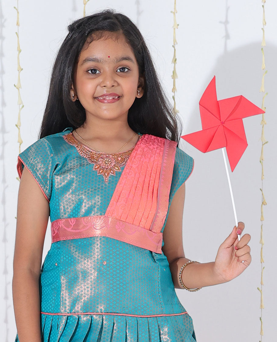 Pink jacquard readymade art silk pavadai with contrast traditional zari design border & embroidery sleeveless blouse
