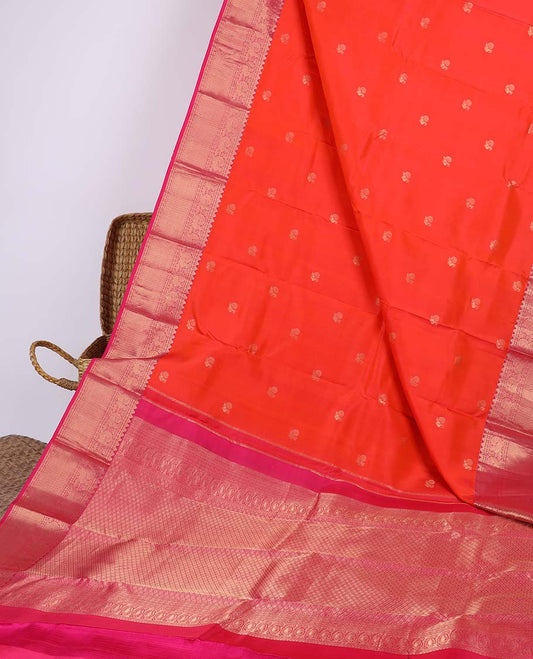 Orange silk saree with mayil buttas, contrast jaal pallu & border of rekku, muthu, kamalam, mayil, neli