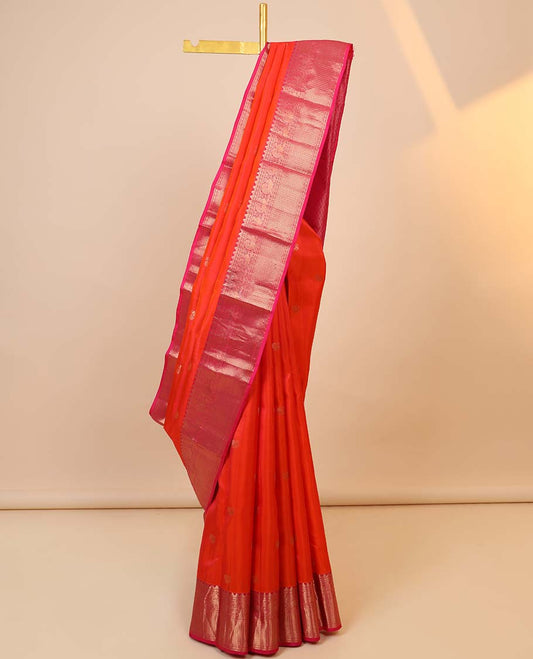 Orange silk saree with mayil buttas, contrast jaal pallu & border of rekku, muthu, kamalam, mayil, neli