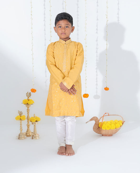 Mustard yellow cotton kurta set features floral vine embroidered full-sleeve kurta & contrast pants