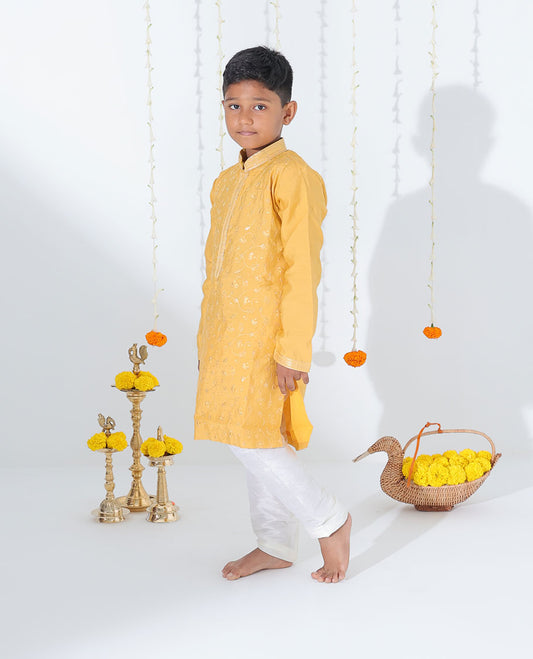 Mustard yellow cotton kurta set features floral vine embroidered full-sleeve kurta & contrast pants