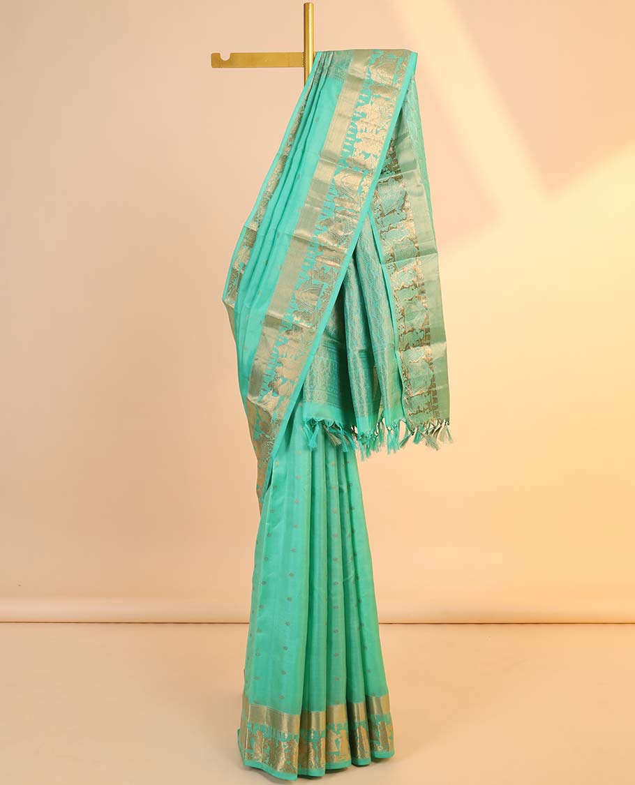 Green silk saree with zari buttas, zari-rich manga design pallu & zari border of wedding-theme motifs weave