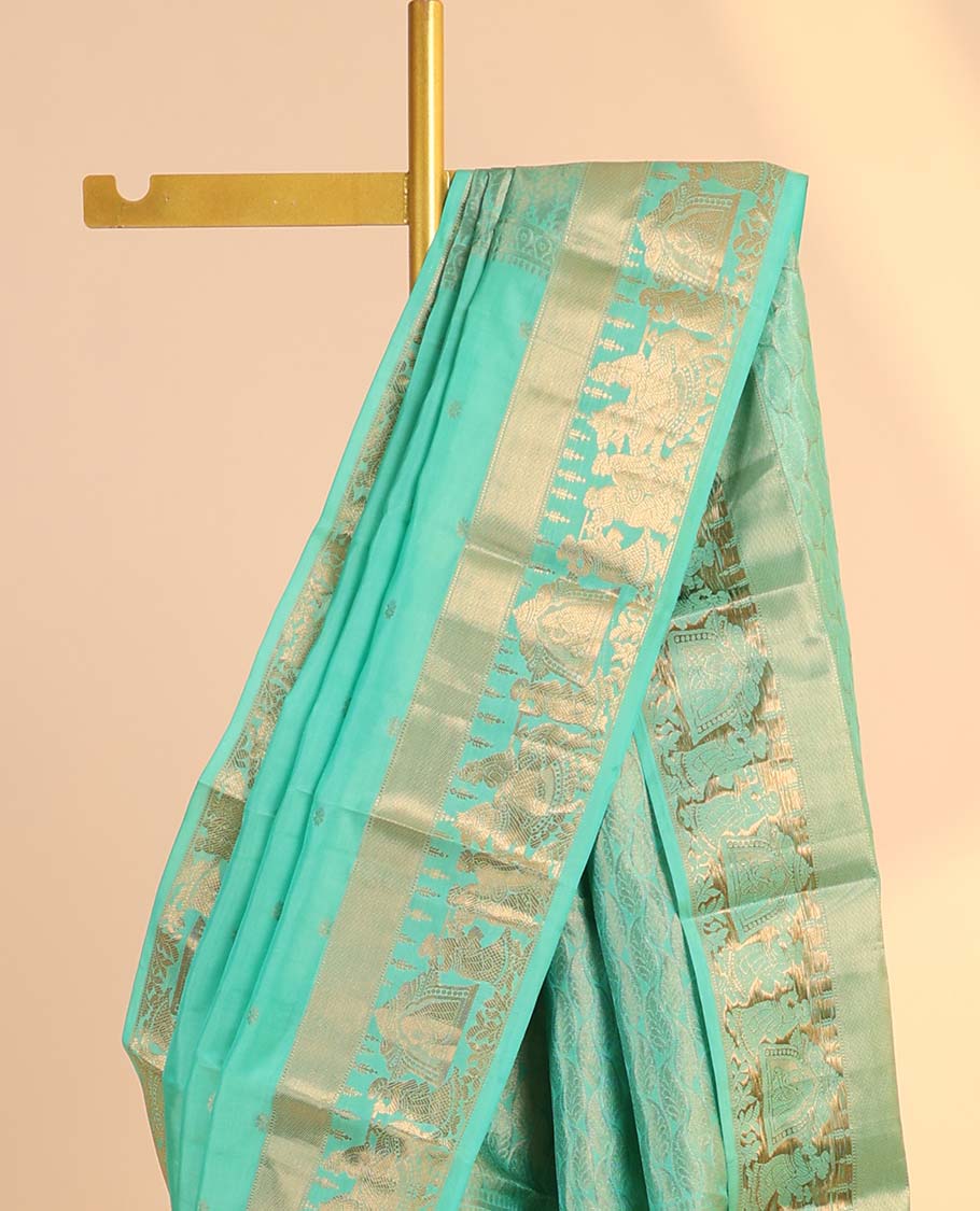 Green silk saree with zari buttas, zari-rich manga design pallu & zari border of wedding-theme motifs weave