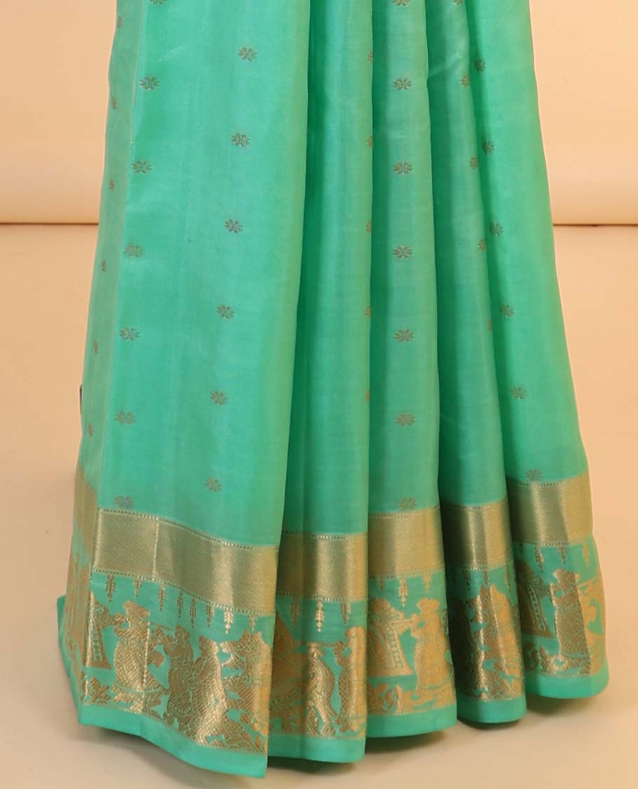 Green silk saree with zari buttas, zari-rich manga design pallu & zari border of wedding-theme motifs weave