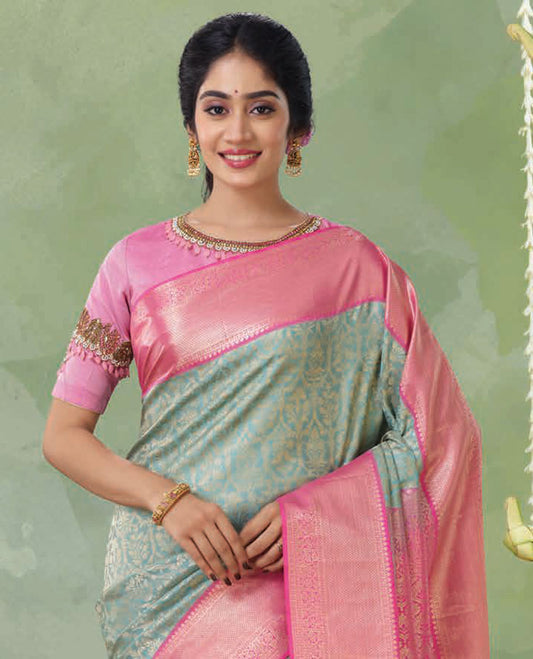 Blue jacquard Kanchipuram silk saree, contrast ogee patterned pallu & border of thilakam mokku,poun & mayil kann