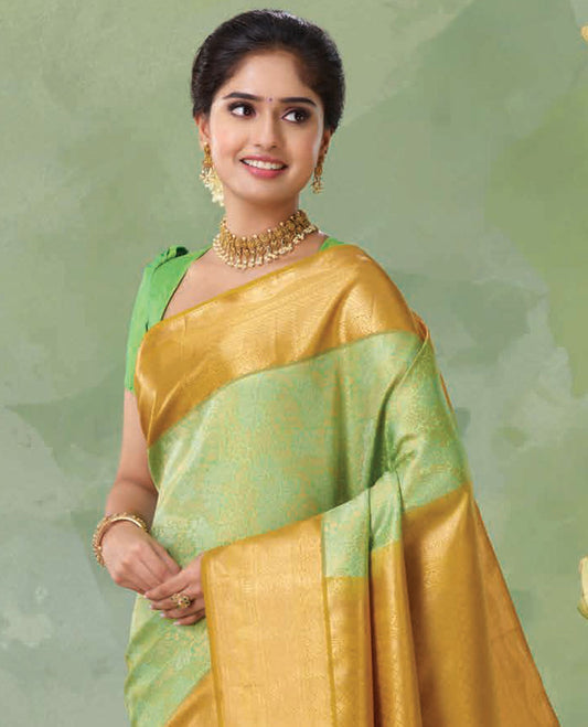 Green jacquard Kanchipuram silk saree, contrast jaal patterned pallu & border of traditional design in zari