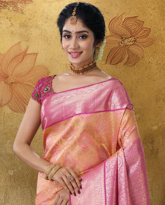Orange jacquard Kanchipuram wedding silksaree, contrast ogee patterned pallu & border of traditional designs 