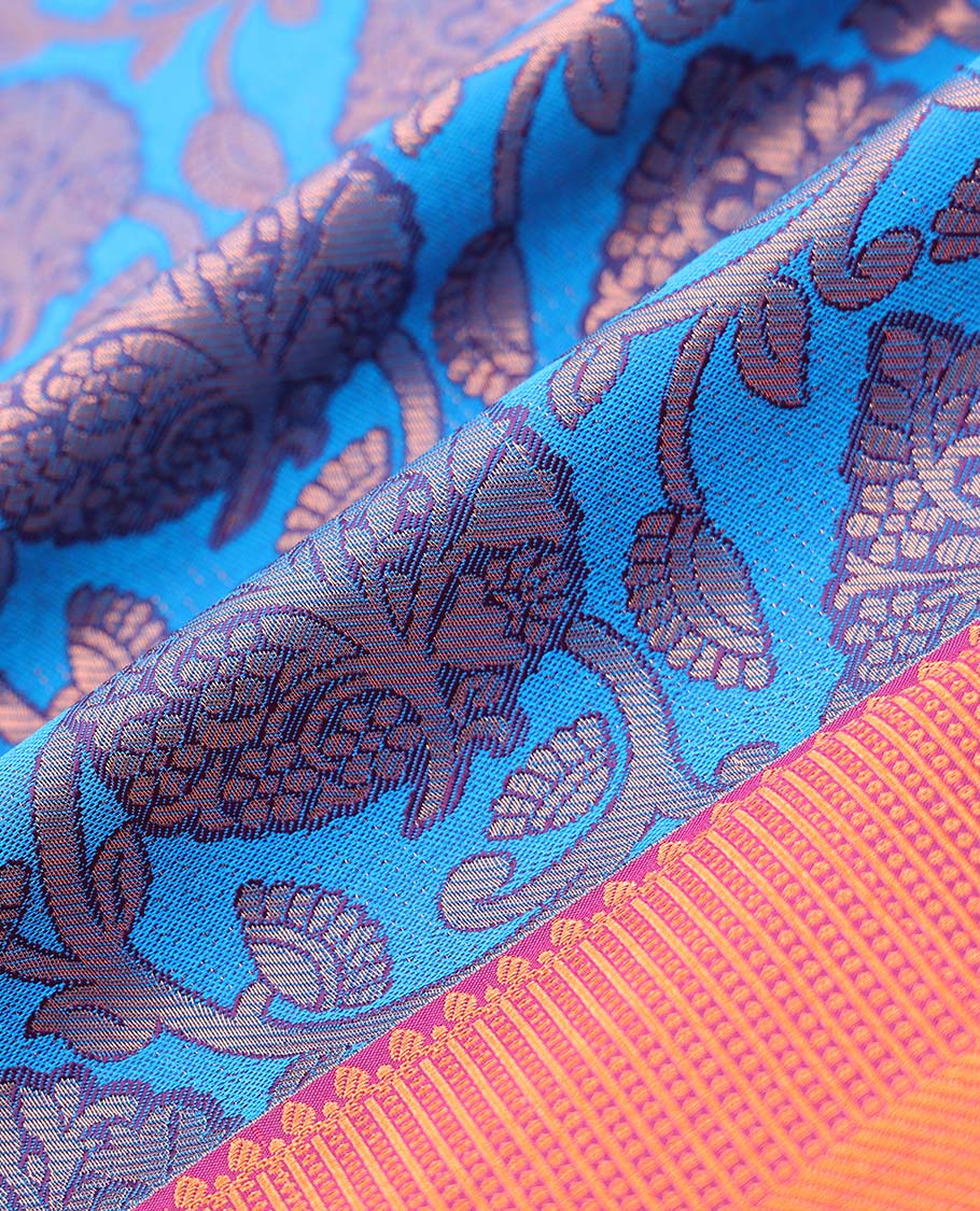 Blue jacquard art silk pavadai, contrast blouse & border of traditional zari designs