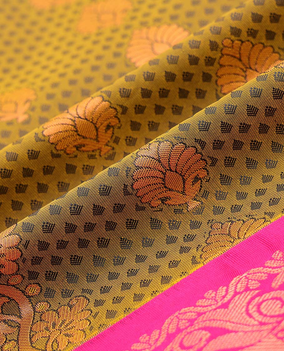 Green embossed art silk pavadai with buttas, contrast blouse & border of traditional zari designs