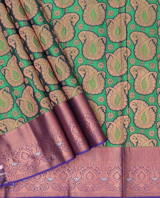 Green paisley design art silk pavadai, contrast blouse & border of traditional zari designs
