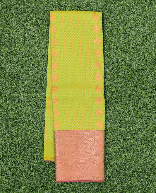 Green embossed art-silk pavadai with buttas, contrast blouse & border of traditional designs