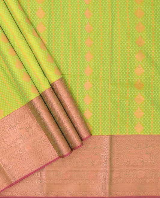 Green embossed art-silk pavadai with buttas, contrast blouse & border of traditional designs