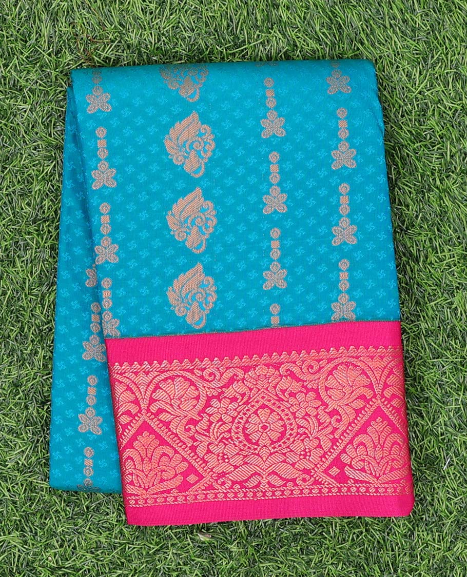 Blue embossed art-silk pavadai with zari buttes, contrast blouse & border of traditional designs