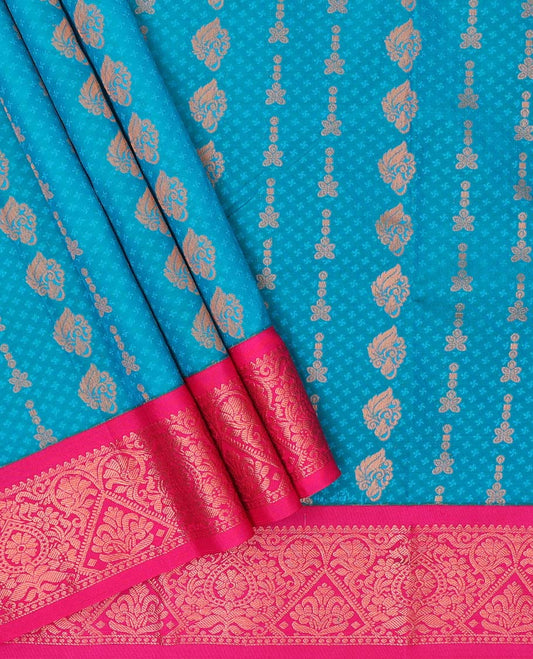 Blue embossed art-silk pavadai with zari buttes, contrast blouse & border of traditional designs