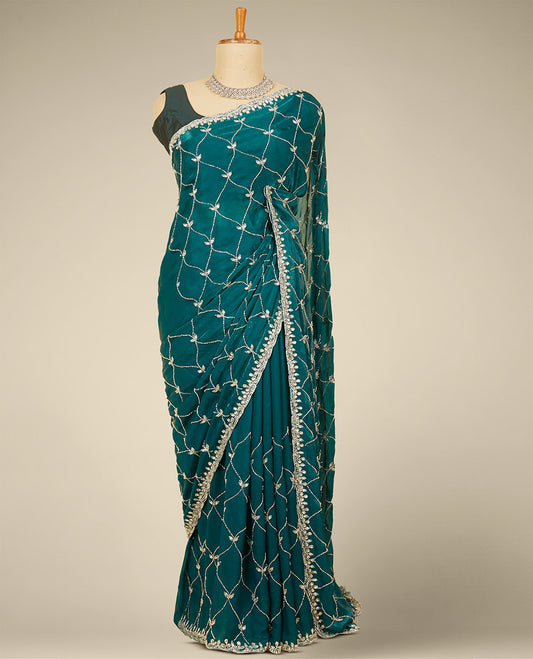 Green ogee pattern embroidered Jimmy choo designer saree, scallop stone embroidered border