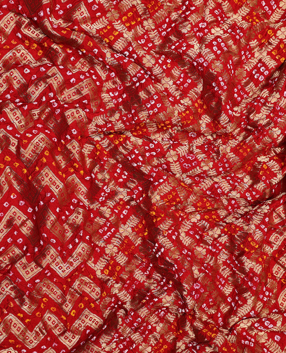 Red bandhani saree with chevron & bandhani buttas, zari border & pallu of intricate zari designs & bandhani dots