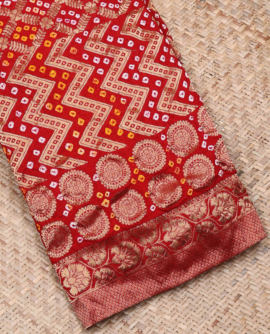 Red bandhani saree with chevron & bandhani buttas, zari border & pallu of intricate zari designs & bandhani dots