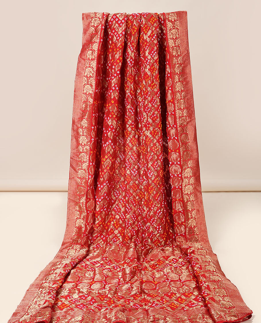 Red bandhani saree with chevron & bandhani buttas, zari border & pallu of intricate zari designs & bandhani dots