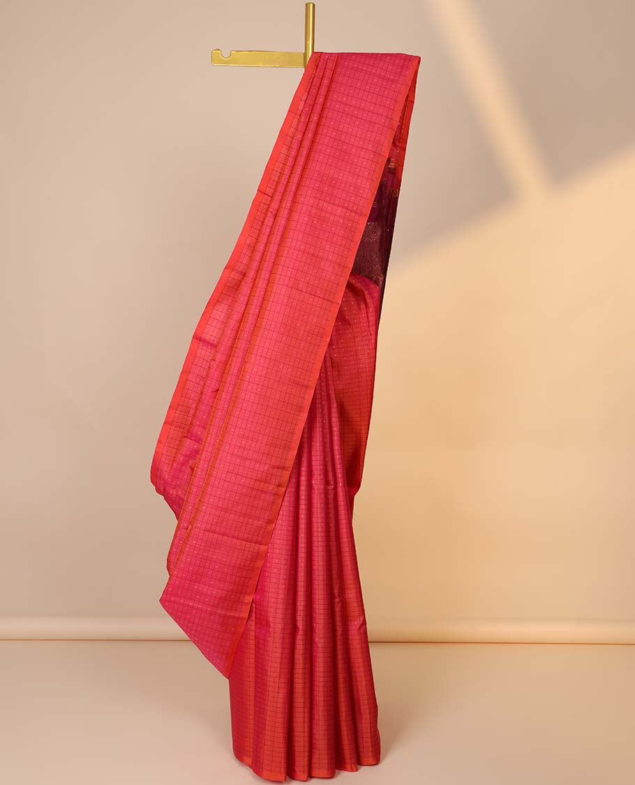 Borderless pink butta enclosed checked kancheepuram silksaree, contrast pallu of traditional designs in zari