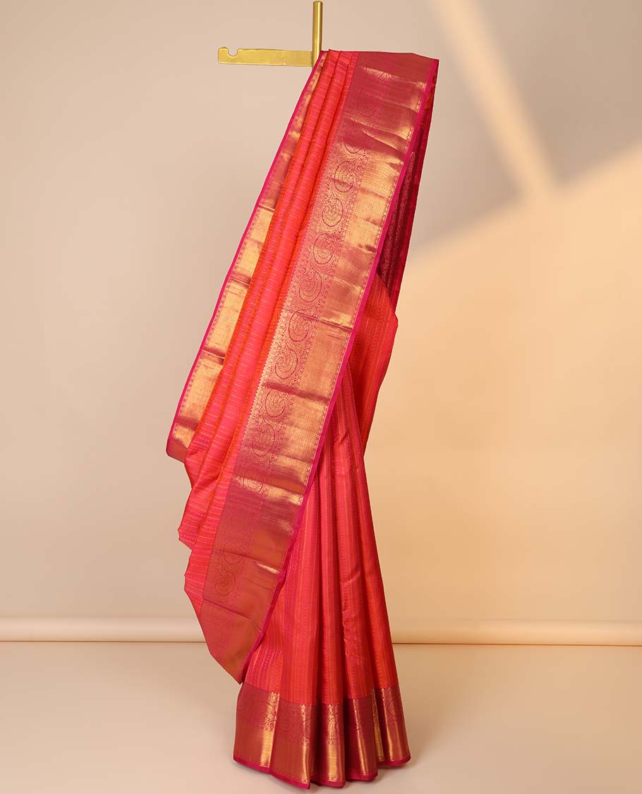 Orange embossed silk saree, contrast paisley pallu & border of thilakam mokku,poun,kodi visiry,banaras & zari stripes