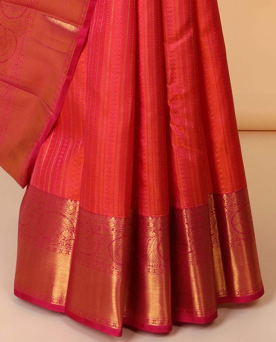 Orange embossed silk saree, contrast paisley pallu & border of thilakam mokku,poun,kodi visiry,banaras & zari stripes