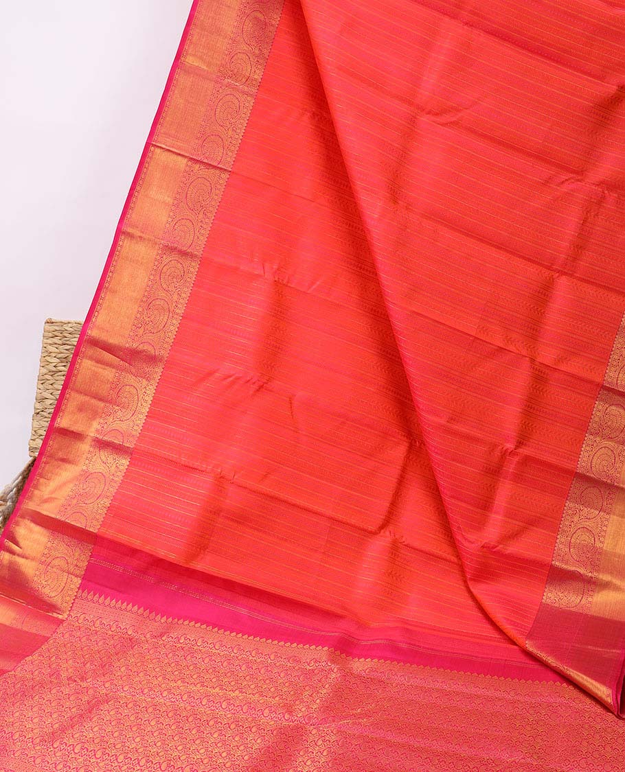 Orange embossed silk saree, contrast paisley pallu & border of thilakam mokku,poun,kodi visiry,banaras & zari stripes