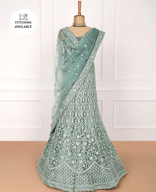 Green net lehenga with jaal & floral embroidered skirt, floral vine embroidered top & embroidered border net dupatta