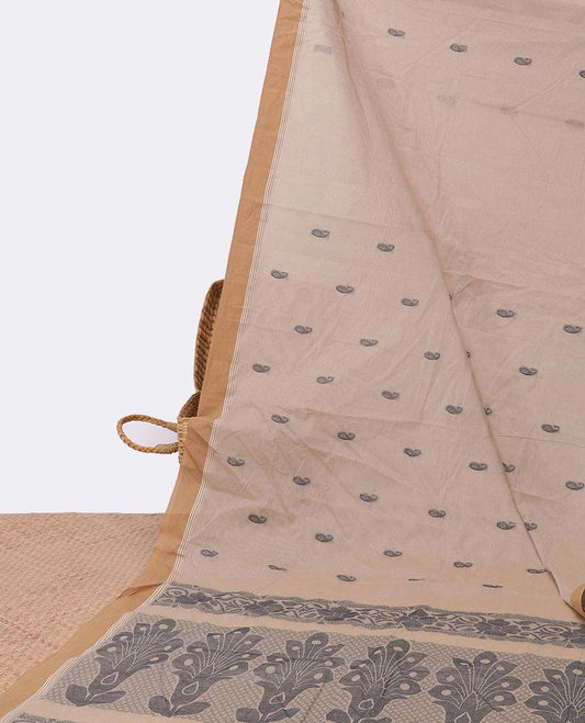 Beige kanchi cotton saree with buttas, contrast plain border & pallu of intricate designs
