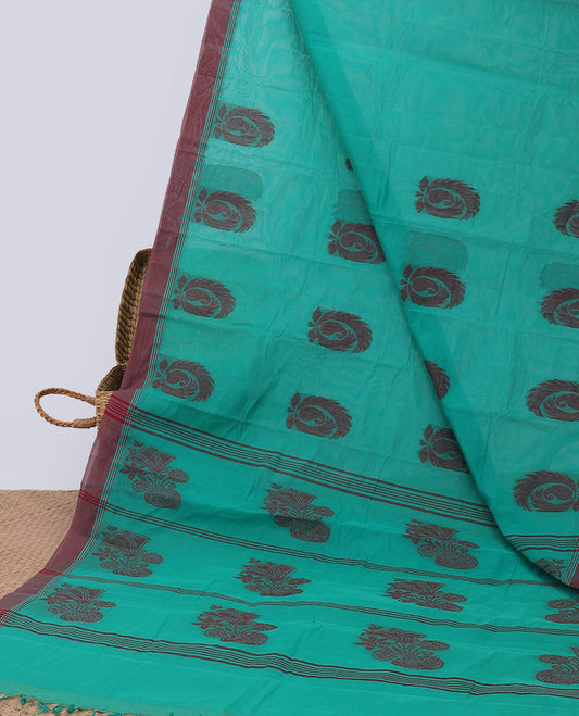 Green kanchi cotton saree with buttas, contrast border & pallu of floral print