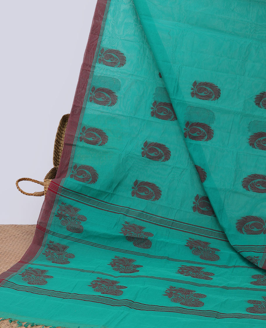 Green kanchi cotton saree with buttas, contrast border & pallu of floral print