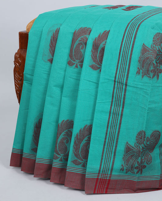 Green kanchi cotton saree with buttas, contrast border & pallu of floral print
