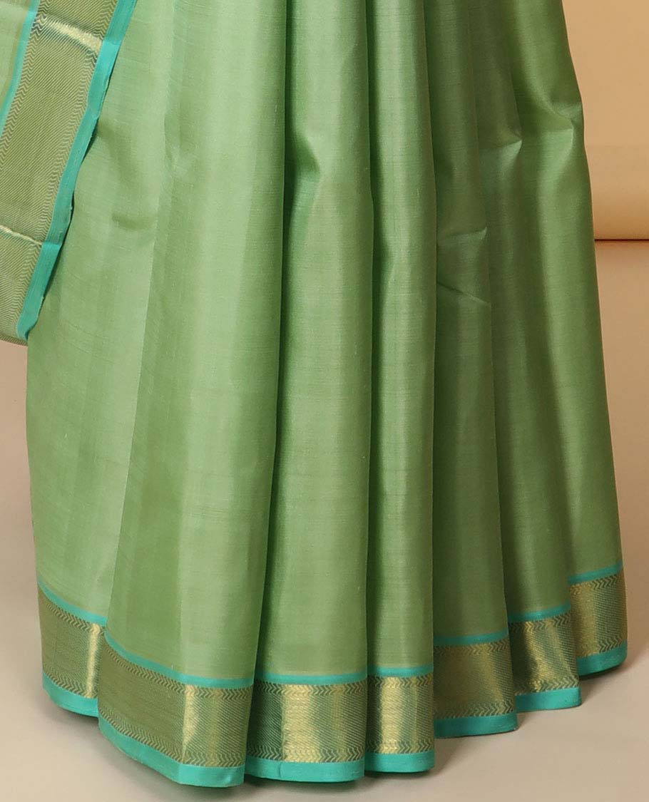 Green plain kancheepuram silksaree, contrast zari border of kathir & zari stripes & pallu of zari designs