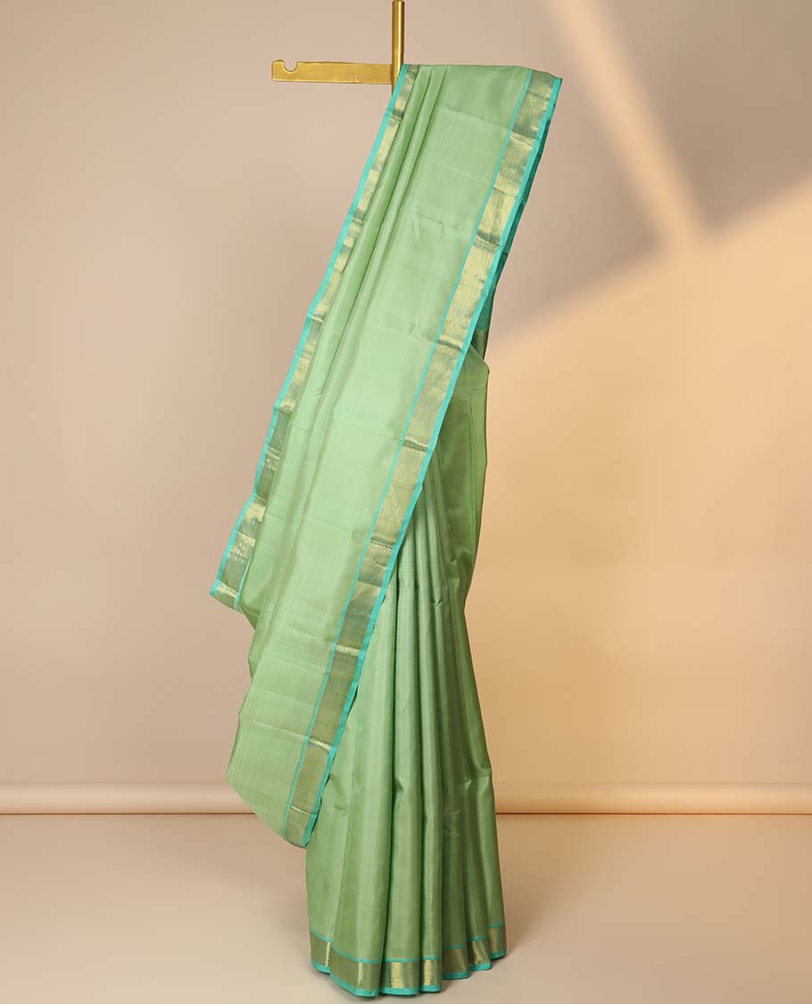 Green plain kancheepuram silksaree, contrast zari border of kathir & zari stripes & pallu of zari designs