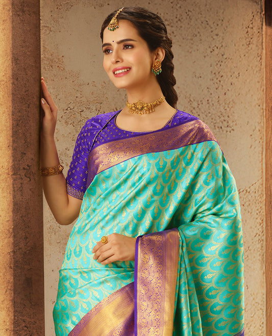 Turquoise jacquard silk saree, contrast intricately woven zari pallu & getti zari border of rekku,kathir,manga & mayil