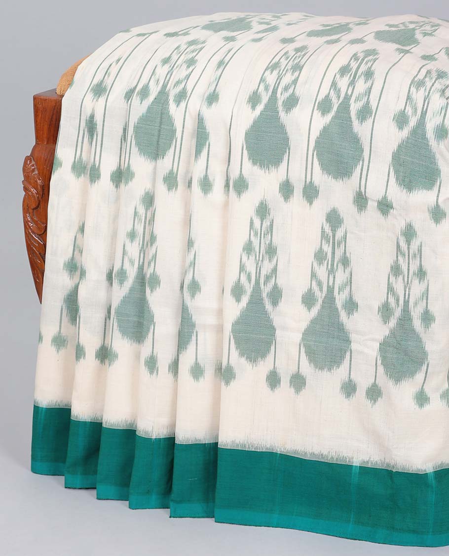 Beige ikkat cotton saree with buttas, contrast border & ikkat design pallu