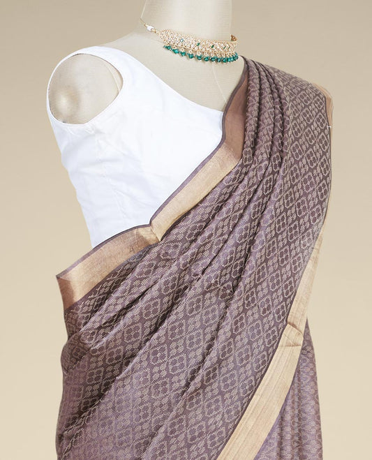 Brown spare intricate ogee patterned tusser silk saree with plain border