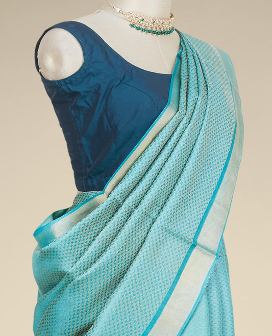 Green intricately designed tusser silk saree, plain border