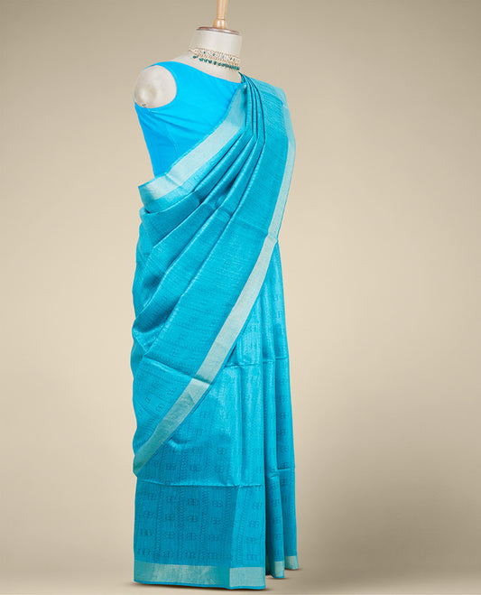 Blue intricate motifs designed tusser silk saree, plain border