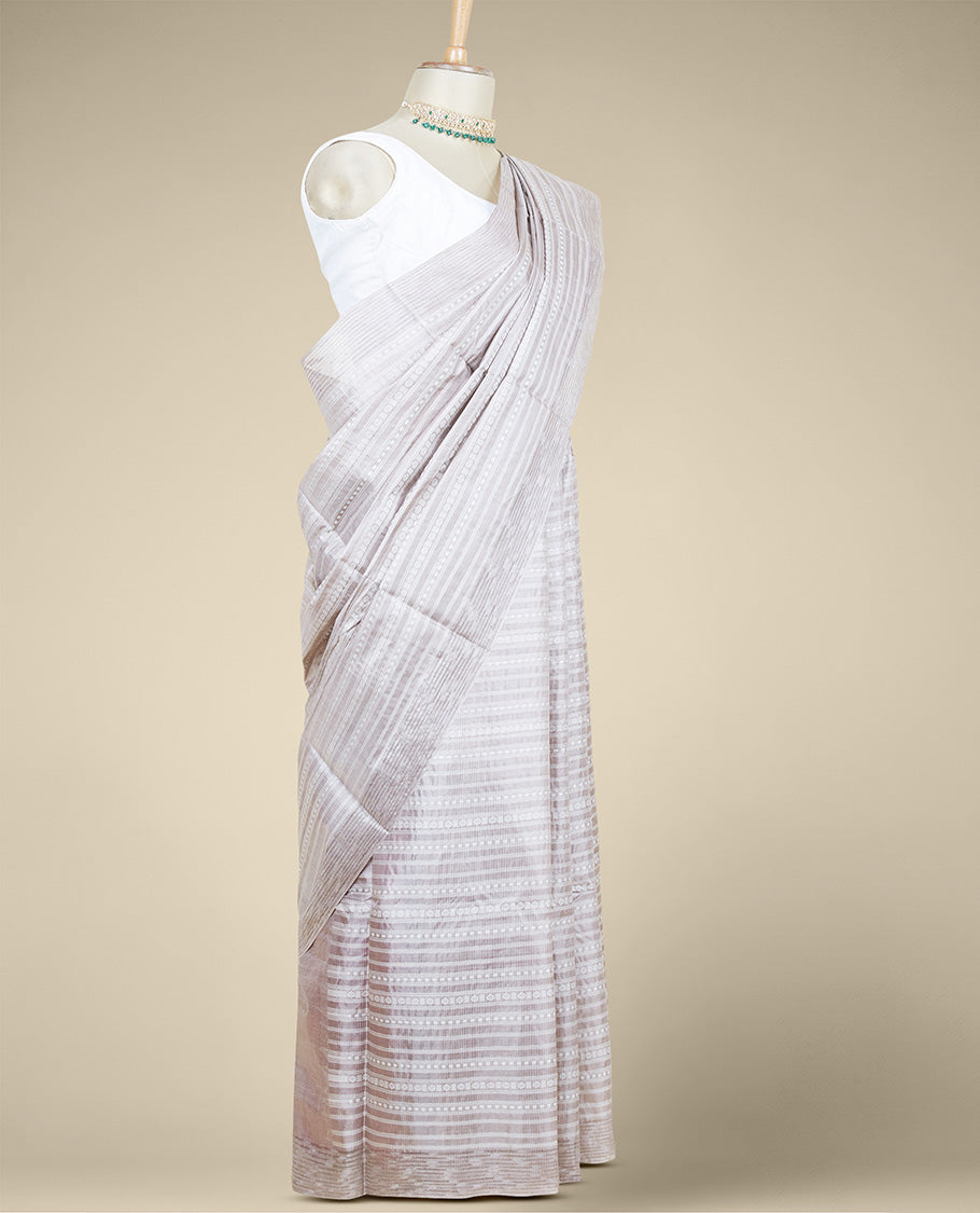 Pale brown geometric patterned tusser silk saree, self-border & intricate pallu