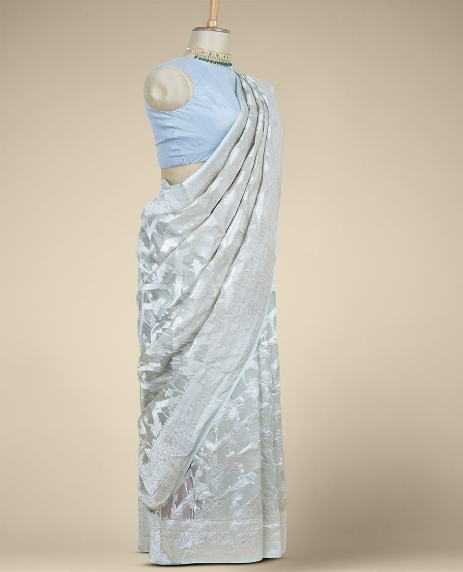 Green floral jacquard banaras georgette saree, self-border of floral & traditional designs