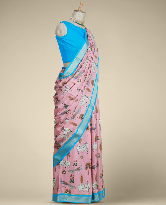 Pink printed mysore silk saree features peacock, floral & pichwai cow motifs, contrast zari border